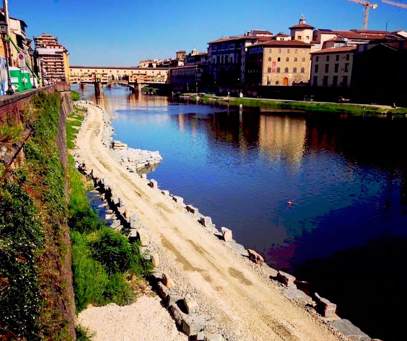 A walkway over the Arno river along the chasm Florence Daily News