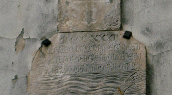 Plaque on Via San Remigio recording the level of the 1333 flood