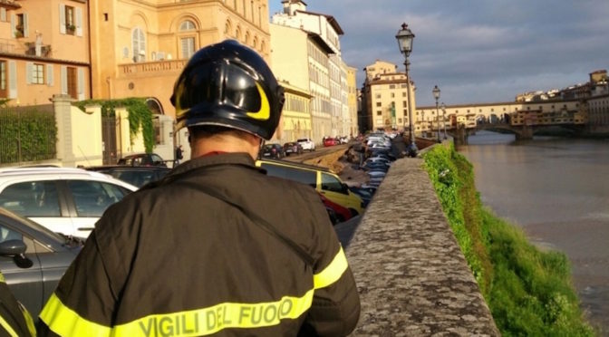 Firefighters at work on the Lungarno after the collapse